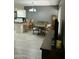 Cozy dining area with wood table set and bar seating adjacent to kitchen area offers versatile space at 1734 W Tuckey Ln # 14, Phoenix, AZ 85015