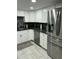 Bright kitchen featuring stainless steel appliances and sleek granite countertops at 1734 W Tuckey Ln # 14, Phoenix, AZ 85015