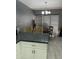 Open kitchen with granite countertop island overlooks the dining area, perfect for casual meals and entertaining at 1734 W Tuckey Ln # 14, Phoenix, AZ 85015