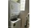 Efficient laundry area features a stacked washer and dryer with plenty of natural light at 1734 W Tuckey Ln # 14, Phoenix, AZ 85015