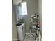 Laundry room with stackable washer and dryer and storage shelving at 1734 W Tuckey Ln # 14, Phoenix, AZ 85015