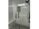 Elegant walk-in shower featuring modern tile design, built-in bench, and sleek fixtures at 1734 W Tuckey Ln # 14, Phoenix, AZ 85015