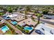 Aerial view features a home with a blue pool and green turf, nestled in a neighborhood with palm trees at 1862 E Tulane Dr, Tempe, AZ 85283