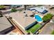 Aerial view of a house with a pool, artificial grass, and a large patio at 1862 E Tulane Dr, Tempe, AZ 85283