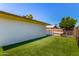 Fenced backyard featuring well kept artificial grass and a swimming pool at 1862 E Tulane Dr, Tempe, AZ 85283