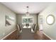 Formal dining room showcases a stylish chandelier and space for hosting dinner parties at 1862 E Tulane Dr, Tempe, AZ 85283