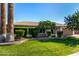 Charming home with a verdant front lawn, mature trees, and colorful blooming bushes adding curb appeal at 1862 E Tulane Dr, Tempe, AZ 85283