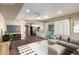 Open-concept living room flows into a modern kitchen with a breakfast bar, perfect for entertaining at 1862 E Tulane Dr, Tempe, AZ 85283