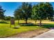 A view of Optimist Park with a sign displaying park regulations at 1862 E Tulane Dr, Tempe, AZ 85283