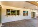 Covered patio and windows to the home's interior; looking out towards yard at 1862 E Tulane Dr, Tempe, AZ 85283