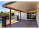 Covered patio with a safety gate; looking towards the pool and the home's yard at 1862 E Tulane Dr, Tempe, AZ 85283
