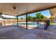 Covered patio overlooking pool; enclosed by a fence and shade at 1862 E Tulane Dr, Tempe, AZ 85283