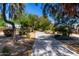View of a paved walking path lined with trees and desert plants at 1862 E Tulane Dr, Tempe, AZ 85283