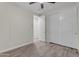Well-lit bedroom with a ceiling fan and ample closet space at 19606 W Grant St, Buckeye, AZ 85326