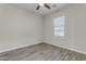 Simple yet stylish bedroom with a ceiling fan and natural light from a window at 19606 W Grant St, Buckeye, AZ 85326