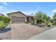Charming single-story home with a paver driveway, low maintenance landscaping, and a two car garage at 19606 W Grant St, Buckeye, AZ 85326