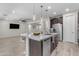 Spacious kitchen island with seating, stainless steel appliances, and open layout at 19606 W Grant St, Buckeye, AZ 85326