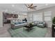 Open-concept living room with modern decor, plush seating, and an inviting atmosphere at 19606 W Grant St, Buckeye, AZ 85326
