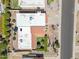 Aerial view of property highlighting the desert landscaping, flat white roof, and backyard green space at 2016 E Orangewood Ave, Phoenix, AZ 85020