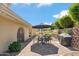 An outdoor patio with a table and chairs, grill, privacy landscaping, and beautiful mountain views at 2016 E Orangewood Ave, Phoenix, AZ 85020