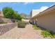 Landscaped backyard with desert plants, a brick walkway, and views of the mountain at 2016 E Orangewood Ave, Phoenix, AZ 85020