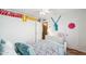 Bright bedroom featuring a bed with a grey comforter and storage spaces at 2016 E Orangewood Ave, Phoenix, AZ 85020