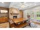 Charming dining room featuring a brick fireplace and views of the backyard at 2016 E Orangewood Ave, Phoenix, AZ 85020