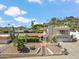 Charming multi-level home featuring a red tile roof, desert landscaping, and an attached two-car garage at 2016 E Orangewood Ave, Phoenix, AZ 85020