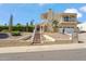 Inviting two-story home with a red tile roof, a two-car garage, and a gated entryway at 2016 E Orangewood Ave, Phoenix, AZ 85020