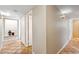 Tiled hallway with unique lighting and decorative niches, adding character and charm to the home at 2016 E Orangewood Ave, Phoenix, AZ 85020