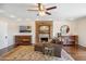 Main bedroom with a fireplace, hardwood floors, with decorative rug at 2016 E Orangewood Ave, Phoenix, AZ 85020