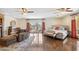 Spacious main bedroom with seating area, hardwood floors, and private outdoor access at 2016 E Orangewood Ave, Phoenix, AZ 85020