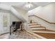 Home office under the stairs, features hardwood floors and a cozy reading nook at 2016 E Orangewood Ave, Phoenix, AZ 85020