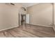 Spacious bedroom with wood-look floors and neutral walls at 20670 N 41St Ave, Glendale, AZ 85308