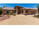 Attractive single-story home featuring desert landscaping and a terracotta roof under a sunny sky at 20670 N 41St Ave, Glendale, AZ 85308