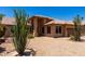 Attractive single-story home featuring desert landscaping and a terracotta roof under a sunny sky at 20670 N 41St Ave, Glendale, AZ 85308