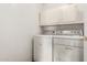 This laundry room has a washer, dryer, and plenty of storage space at 20670 N 41St Ave, Glendale, AZ 85308