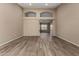 Expansive living room showcasing wood-look floors, architectural arches, and an open floor plan at 20670 N 41St Ave, Glendale, AZ 85308