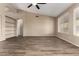 Bright living room featuring wood-look floors, neutral walls, and windows providing ample natural light at 20670 N 41St Ave, Glendale, AZ 85308