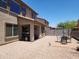 Well-maintained backyard featuring gravel, patio, and outdoor dining area at 2317 E Mohave Ln, Apache Junction, AZ 85119