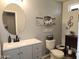 Well-lit bathroom features a white countertop vanity and decorated with charming wall art at 2317 E Mohave Ln, Apache Junction, AZ 85119