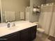 Practical bathroom with a dark wood vanity and a shower curtain at 2317 E Mohave Ln, Apache Junction, AZ 85119