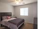 Cozy bedroom with a plush bed, soft lighting, and a large window at 2317 E Mohave Ln, Apache Junction, AZ 85119