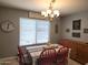Bright dining area featuring a chandelier and a view from the window at 2317 E Mohave Ln, Apache Junction, AZ 85119