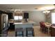Open kitchen with breakfast bar, and a dining area offering a modern living space at 2317 E Mohave Ln, Apache Junction, AZ 85119