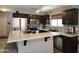 Stylish kitchen with stainless steel appliances, black sink and speckled countertops at 2317 E Mohave Ln, Apache Junction, AZ 85119