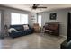 Comfortable living room with tile flooring, a ceiling fan and neutral colors at 2317 E Mohave Ln, Apache Junction, AZ 85119