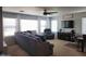 Relaxing living room featuring neutral tones, a ceiling fan, and multiple seating options at 2317 E Mohave Ln, Apache Junction, AZ 85119