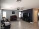 Spacious living room featuring tile floors, a ceiling fan, and a cozy seating area at 2317 E Mohave Ln, Apache Junction, AZ 85119