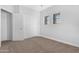 Bright bedroom with two sunny windows and closet space offers a blank slate for your design ideas at 2565 S Signal Butte Rd # 30, Mesa, AZ 85209